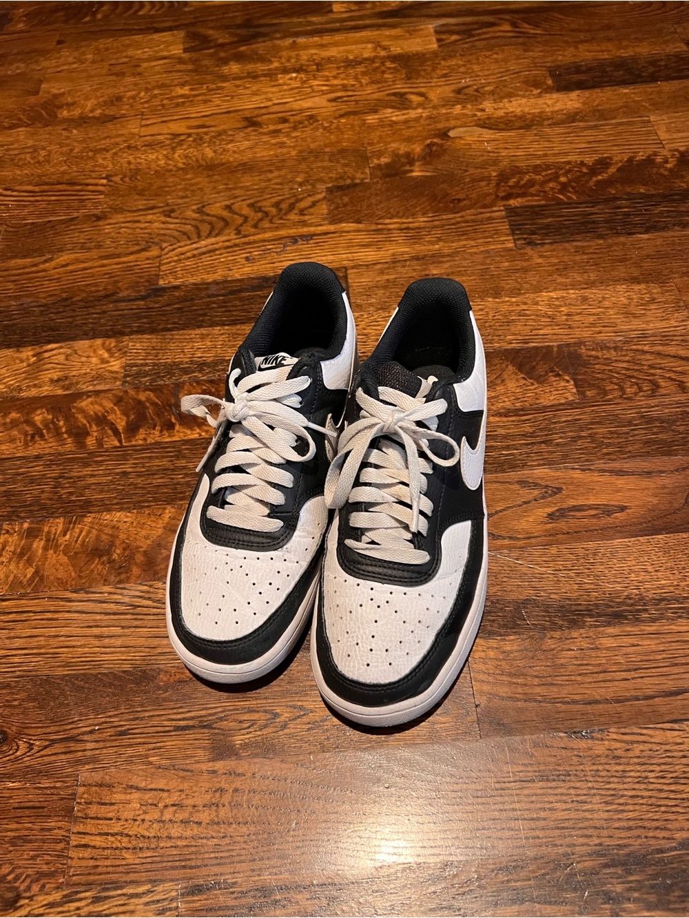 Nike women’s Black & White Low-Top Sneakers